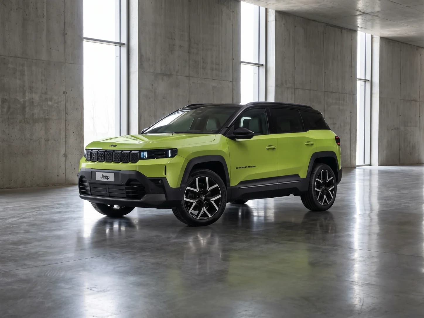 Green Jeep Compass in a concrete hall